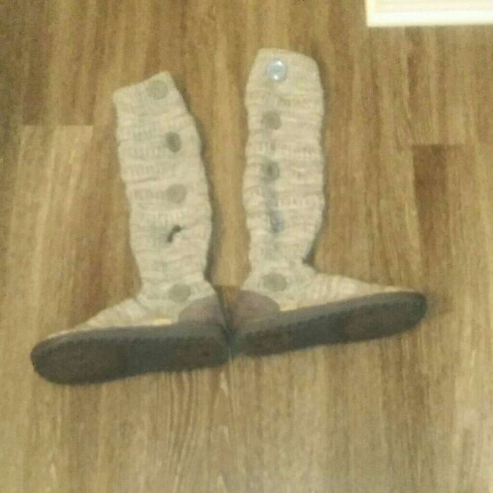 Gray boots with buttons on the side